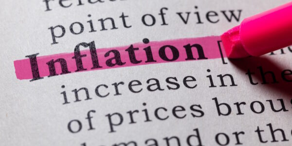a pink highlighter highlighting inflation in a dictionary