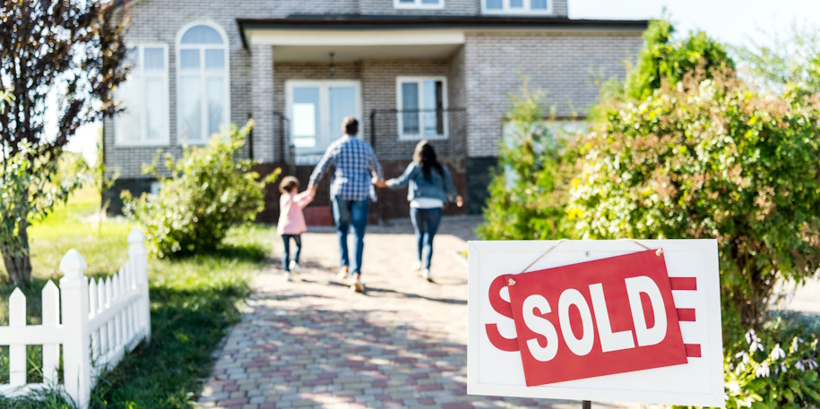 family walking up to their new home family walking up to their new home