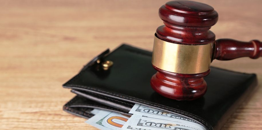 gavel on wallet with money gavel on wallet with money