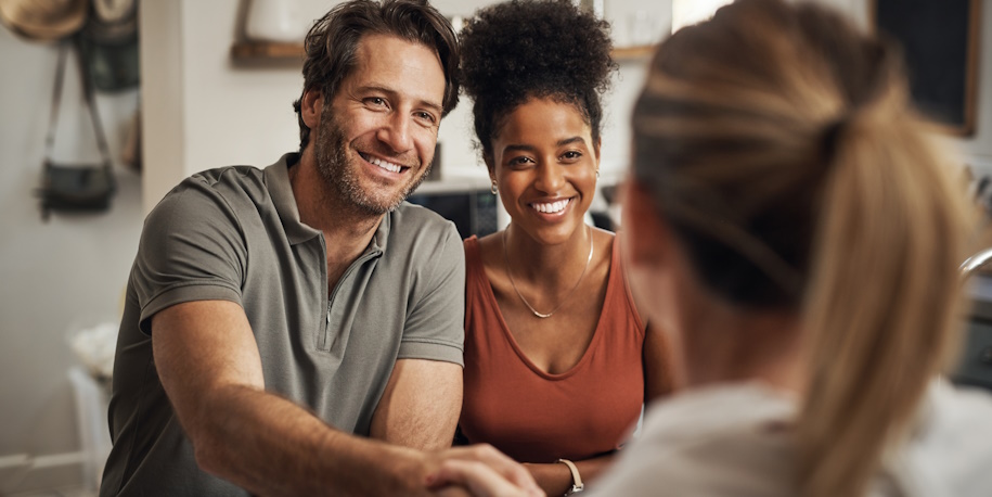 relieved couple talking to lawyer relieved couple talking to lawyer