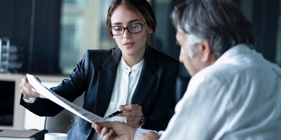 lawyer discussing paperwork with client