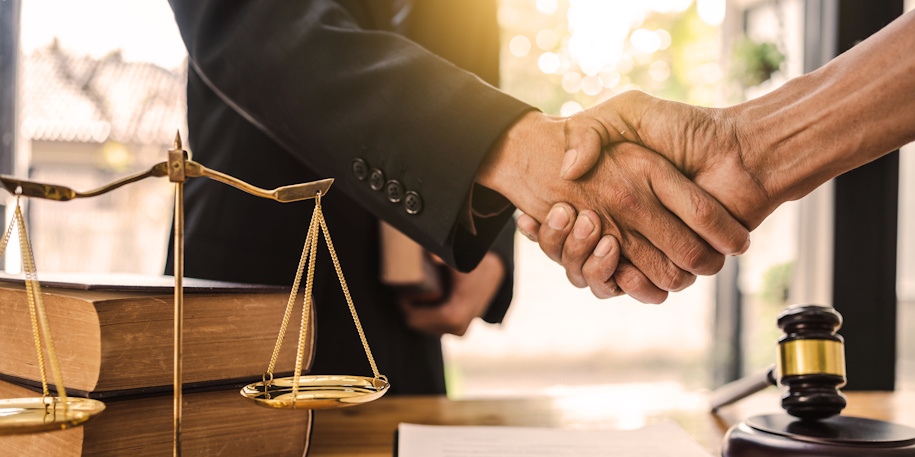 lawyer shaking hands with client