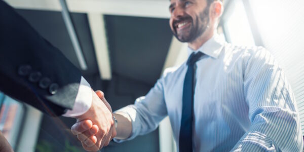 lawyer shaking hands with man