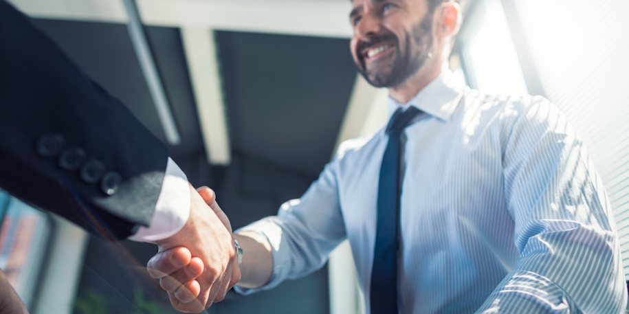 lawyer shaking hands with man lawyer shaking hands with man