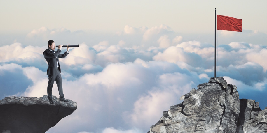 looking for red flag Abstract image of businessman with telescope looking into the distance while standing on edge of cliff, mock up place on sky with clouds background, red flag. Success, challenge, future and growth concept