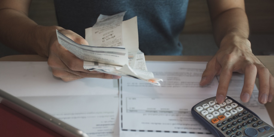 man using calculator for  calculate expenses accounts man using calculator for calculate expenses accounts