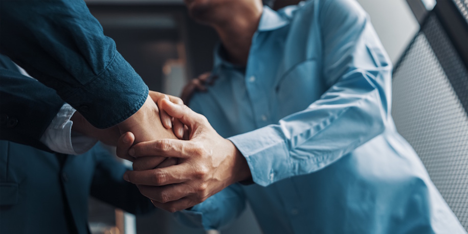 man shaking hands with bankruptcy lawyer man shaking hands with bankruptcy lawyer