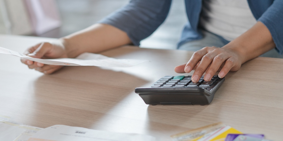 woman calculating debt