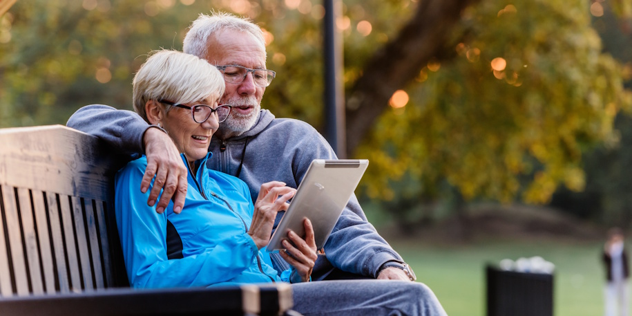 retired couple on park bench