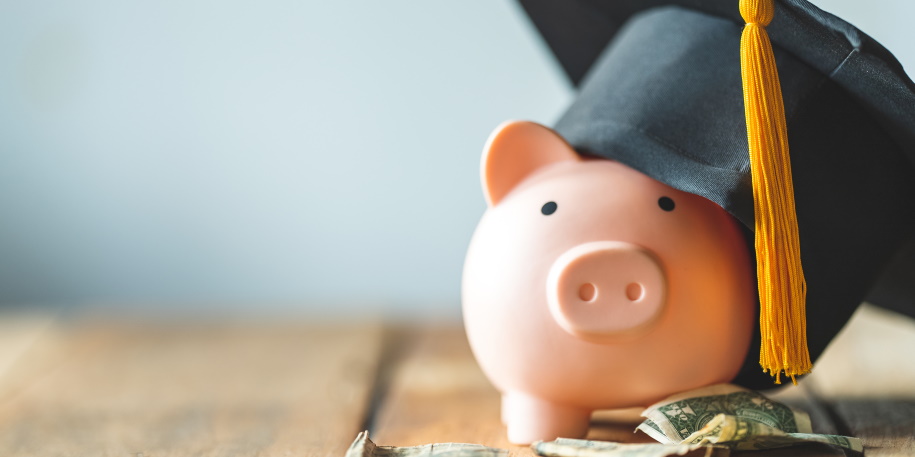 student loan debt settlement piggy bank With Graduation Cap on