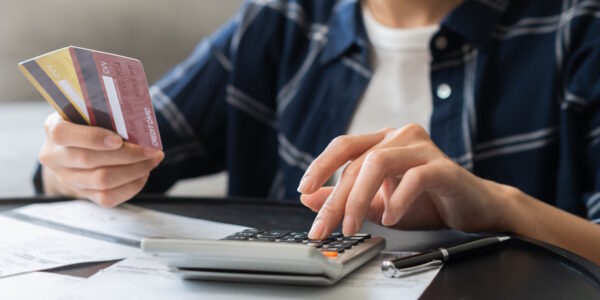 woman calculating credit card debt