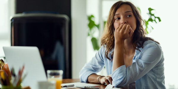 woman worried reviewing finances woman worried reviewing finances